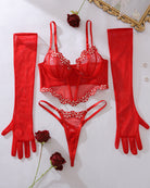 Red lace corset bra set with thong and long red gloves, laid out flat