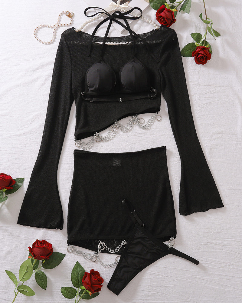 Black sheer long-sleeve top, mini skirt, and panty set with chain belt