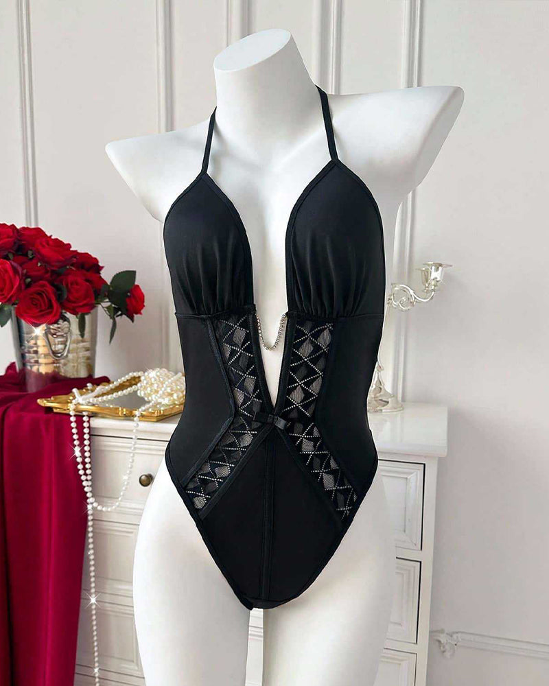Black halter-neck bodysuit on mannequin with deep V front and lattice insert