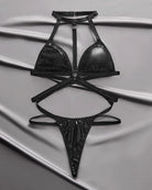 Black leather halter-neck triangle bra and thong with strappy cross bands