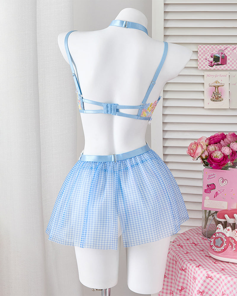 Light blue lace mesh bralette with back straps and plaid mini skirt on mannequin