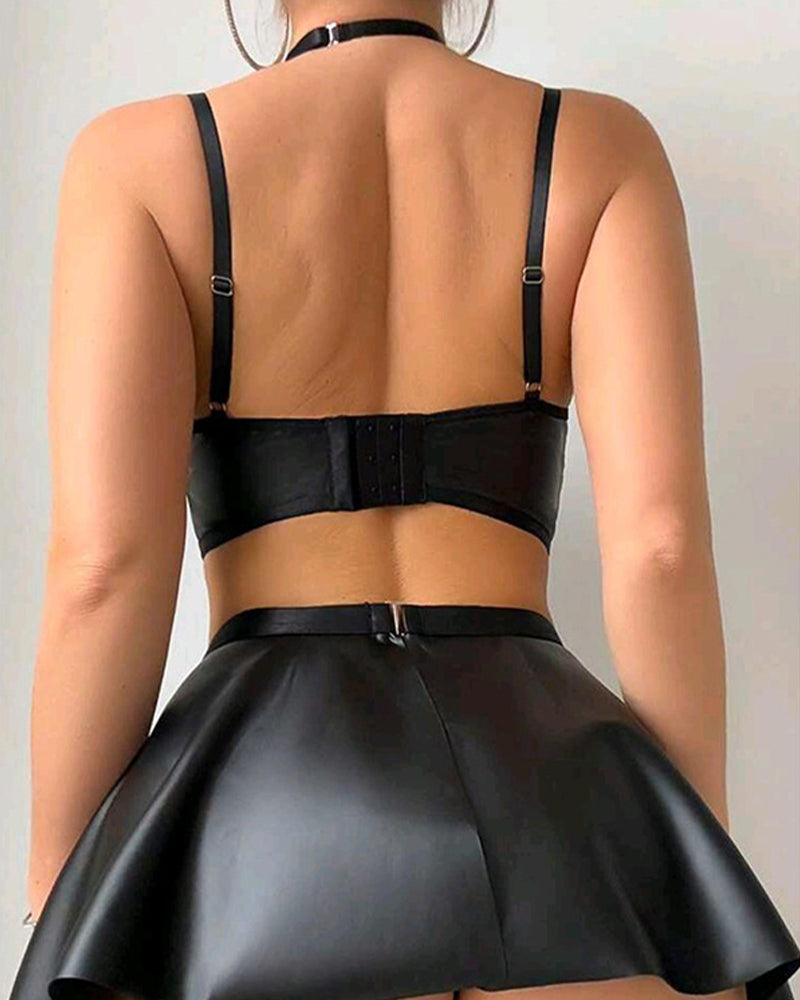 Back view of black lace-up bra and flared mini skirt set with adjustable shoulder straps