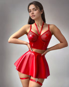 Red lace-up fishnet bra and mini skirt set with harness straps and garter belts
