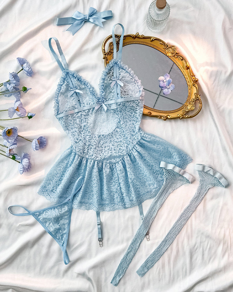 Sky blue lace babydoll mini dress with matching garter straps and bows, flat lay