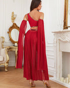 Red asymmetrical crop top and mesh maxi slit skirt set, back view with draped sleeves