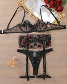 Black lace lingerie set with heart embroidery: bra, lace panty, and garter straps