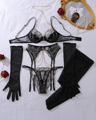 Black mesh lingerie set flat lay: bra, garter belt, thong, gloves, thigh-high stockings