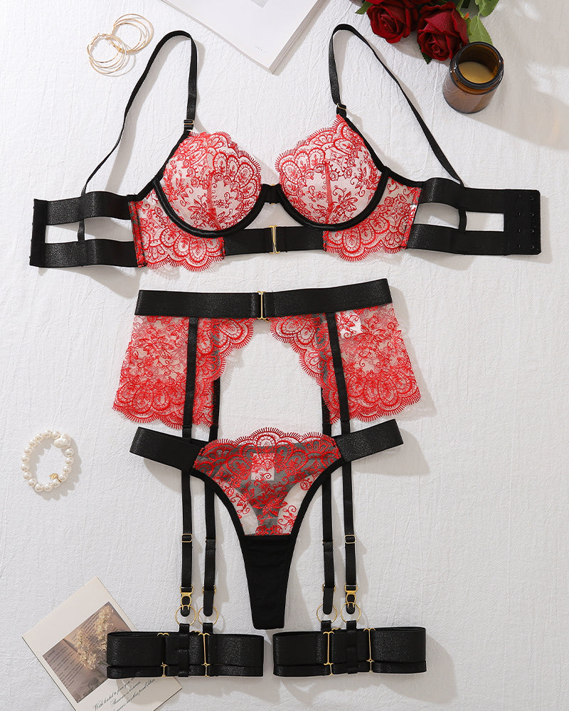 Red and black lace lingerie set with underwire bra, garter belt, and thong