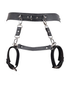 Black leather bondage harness waistband with two hanging wrist cuffs and chain links