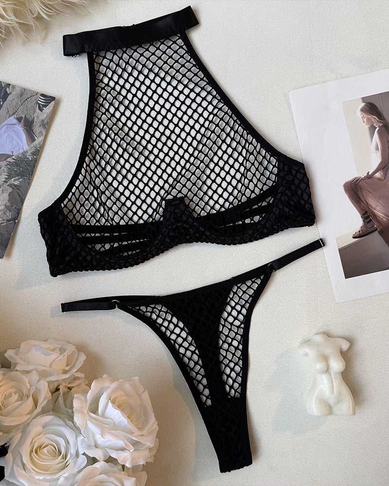 Fishnet halter mesh bra and thong set, black, flat lay of bra and thong