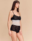 Black and white lace camisole and shorts set, angled side view with thin straps