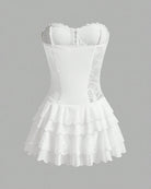 White lace corset tutu dress with structured bodice and tiered ruffle skirt