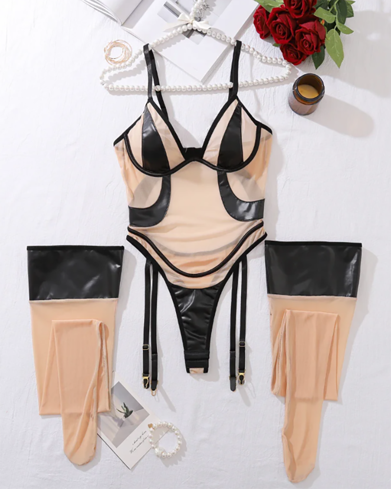 Black mesh bodysuit with PU panels and garter straps with matching stockings
