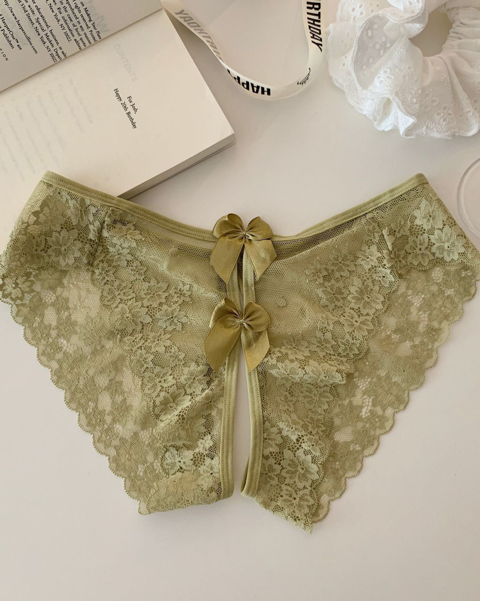 Scalloped sheer lace bow-back panties in olive green with three bow accents