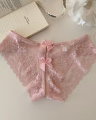 Sheer floral lace bow-back panties in blush pink with center ribbon bows