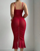 Red ruched midi bodycon dress with spaghetti straps and flared hem