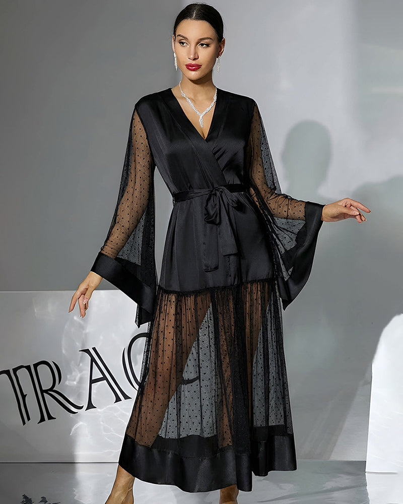 Black belted robe dress with V-neck, semi-sheer polka-dot sleeves and tiered hem