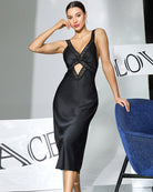 Black satin midi slip dress with lace-trim V neckline and diagonal front cutout