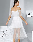 White off-shoulder chiffon babydoll dress with dotted sheer layered skirt, back view