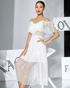 White off-shoulder chiffon babydoll dress with dotted sheer skirt and layered bodice ruffles