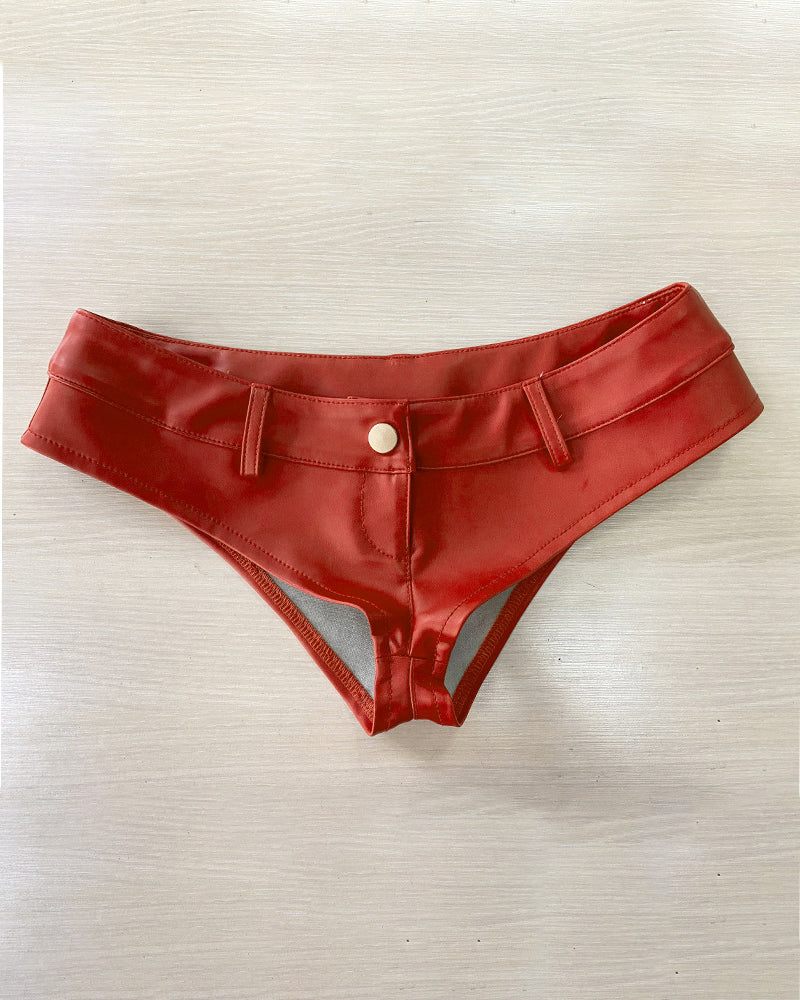Red faux leather low-rise booty shorts with center button and stitched seams