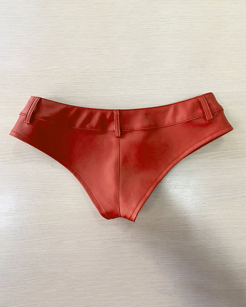 Red faux leather low-rise booty shorts with button front and folded waistband