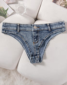 Light blue denim thong low-rise panties with button front and stitched waistband.