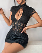 Black corset top with cap sleeves, lace bodice, front grommet lacing and neck tie