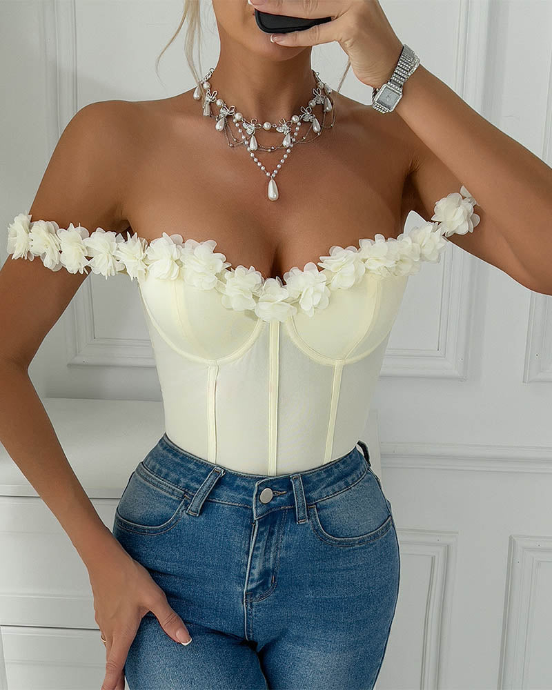 White off-shoulder corset bodysuit with scalloped floral trim and vertical seams