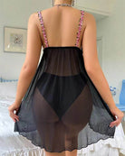 Black floral embroidered sheer mesh babydoll, open-back view, pink trim and tiered skirt