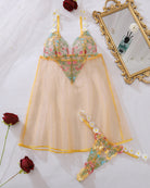 Yellow floral sheer mesh babydoll and thong set with daisy appliques, laid out