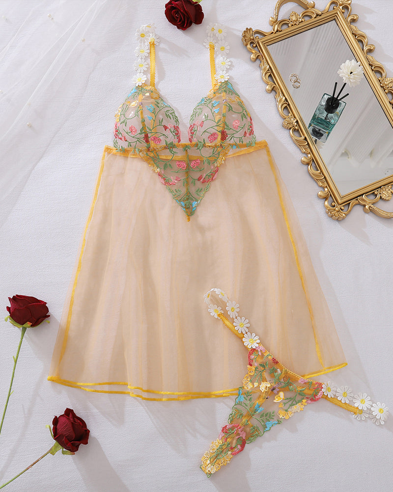 Yellow floral sheer mesh babydoll and thong set with daisy appliques, laid out