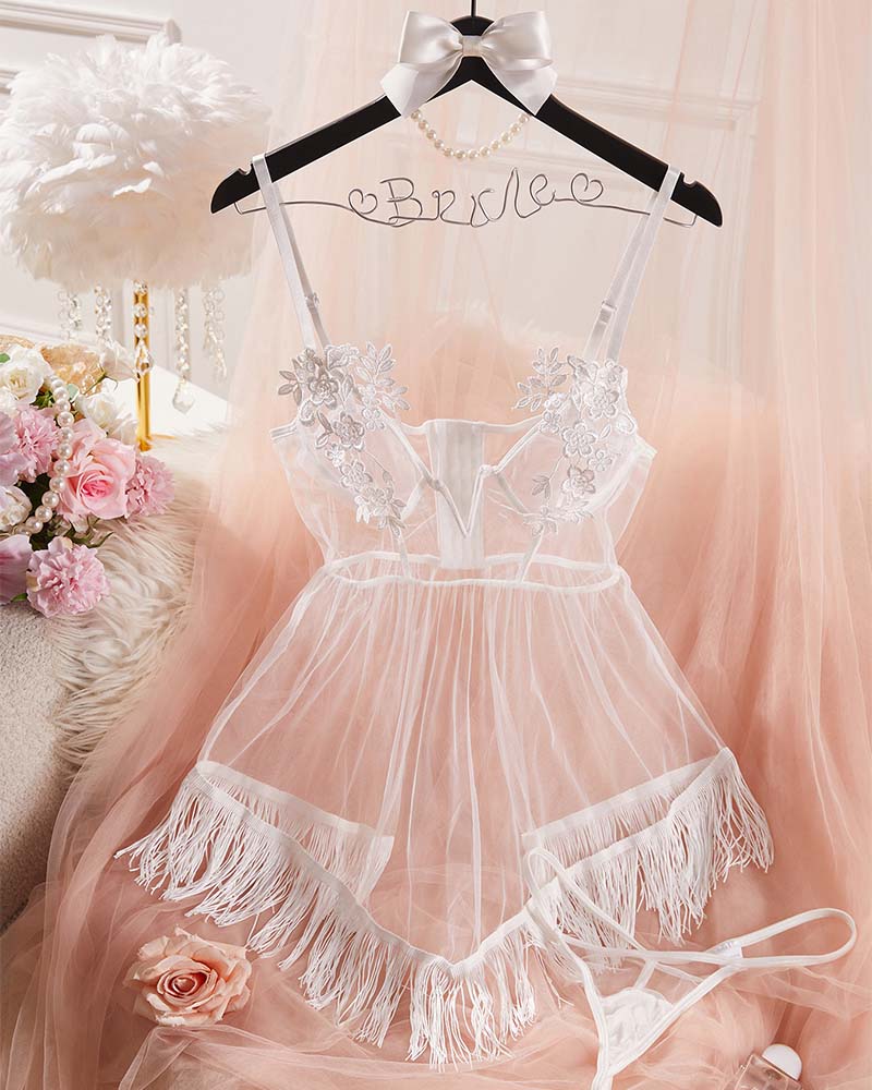 White sheer mesh babydoll lingerie with floral lace appliques and fringe mini skirt on hanger