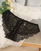 Black lace crisscross brief panties with lace-up front and scalloped trim