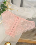 Pink lace crisscross brief panties with lace-up front and scalloped trim