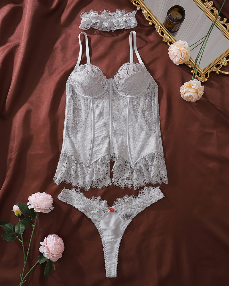 Silver lace bustier corset lingerie set with thong, flat lay