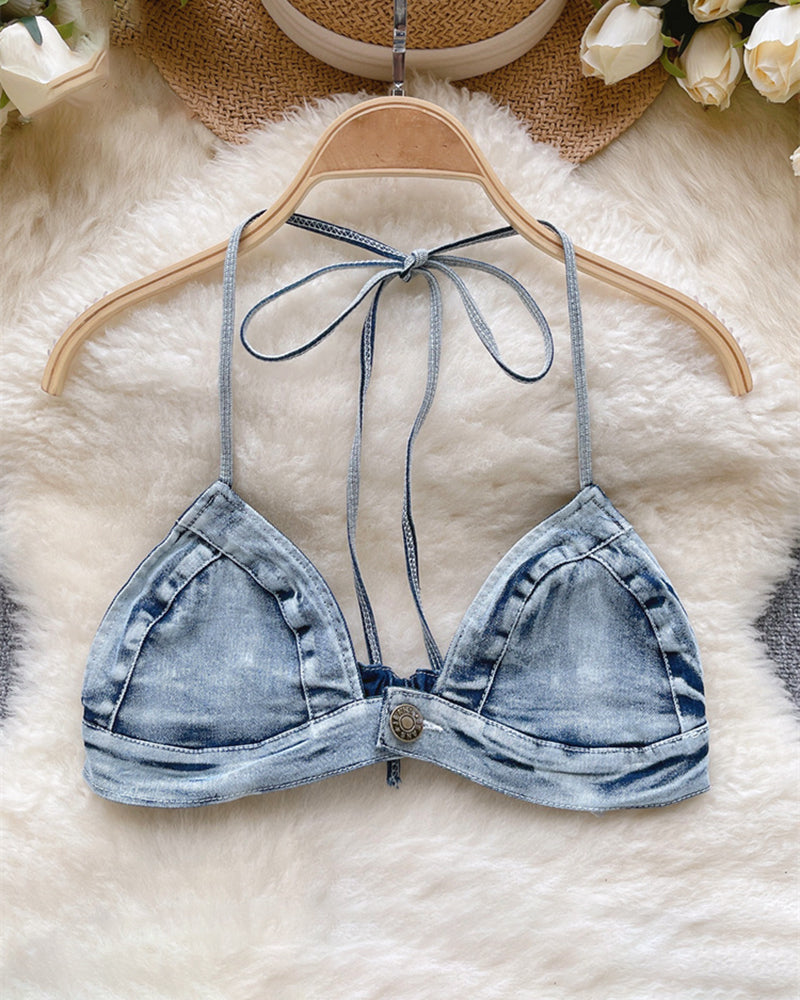 Light-wash denim halter bra top with tie-neck straps on a hanger