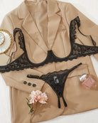 Black lace cupless bra and crotchless thong set with scalloped trim and straps