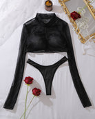 Black sheer zip-front long-sleeve crop top and thong set, flat lay