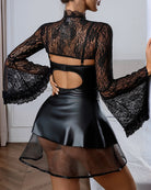 Black faux leather corset mini dress with long lace sleeves and exposed back cutout