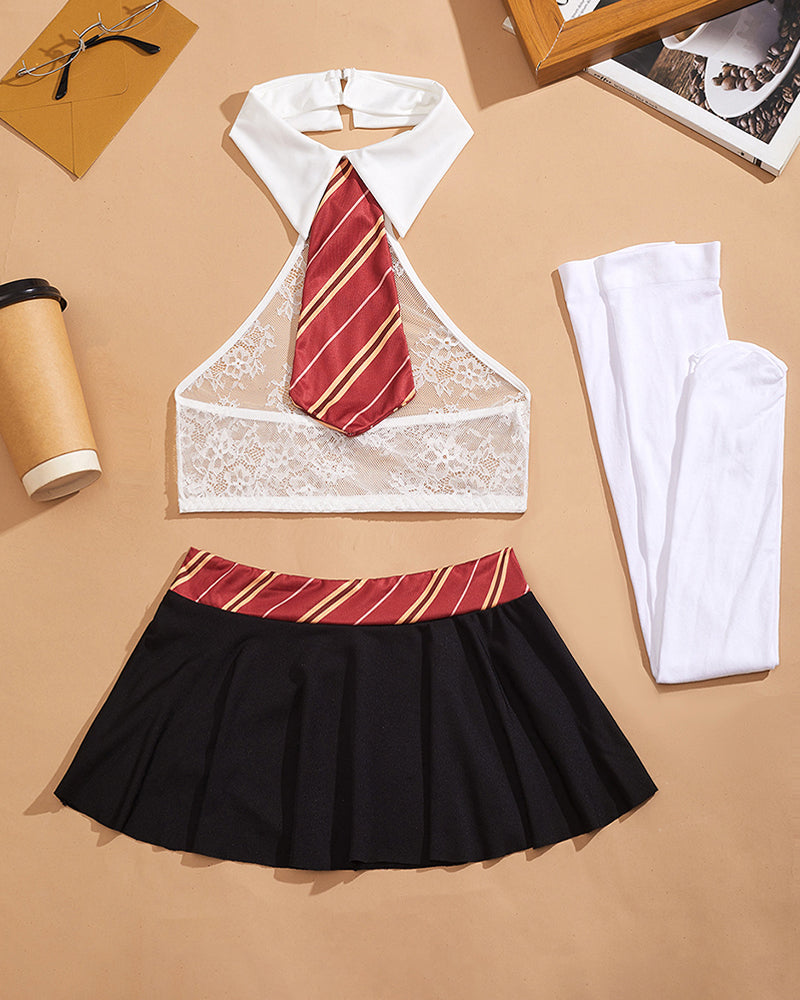 White lace halter crop top with red striped tie, black pleated mini skirt, paired white stockings