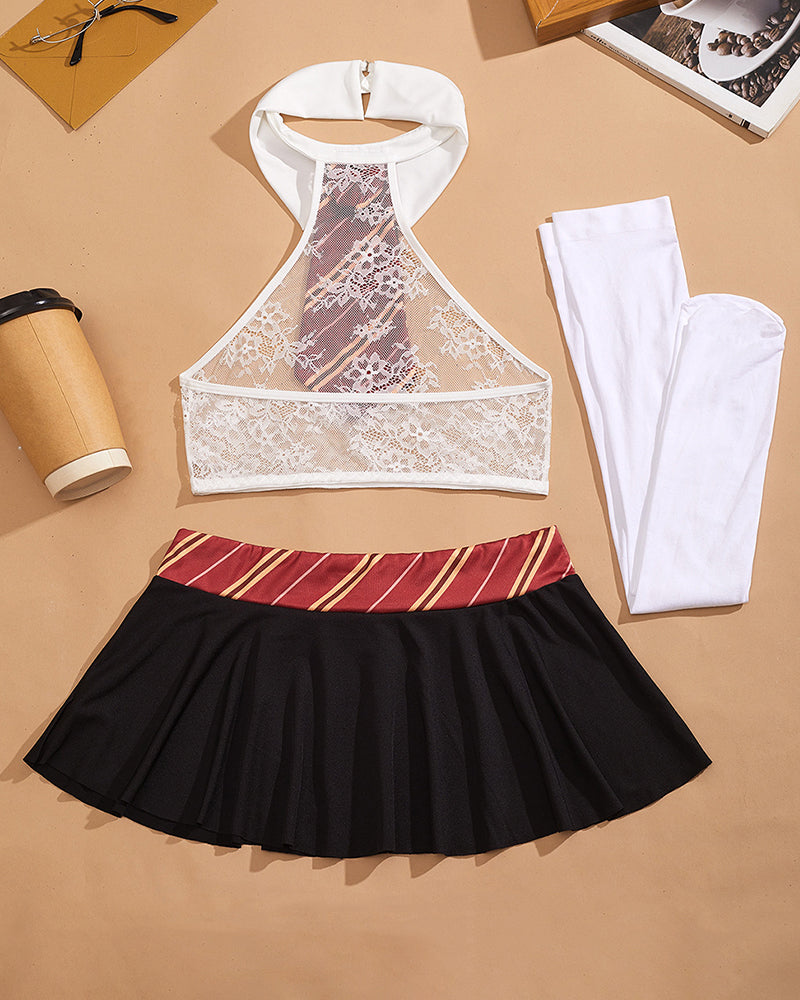 White lace halter crop top with red striped necktie, black pleated mini skirt, white socks