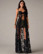 Black lace strapless corset-style sheer maxi lingerie dress with decorative heart motif
