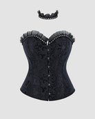 Black strapless corset top with ruffled edge and center buttons on textured fabric