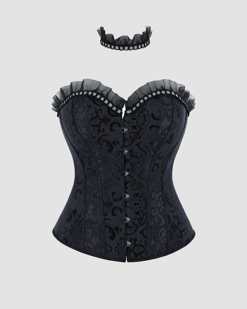 Black strapless corset top with ruffled edge and center buttons on textured fabric