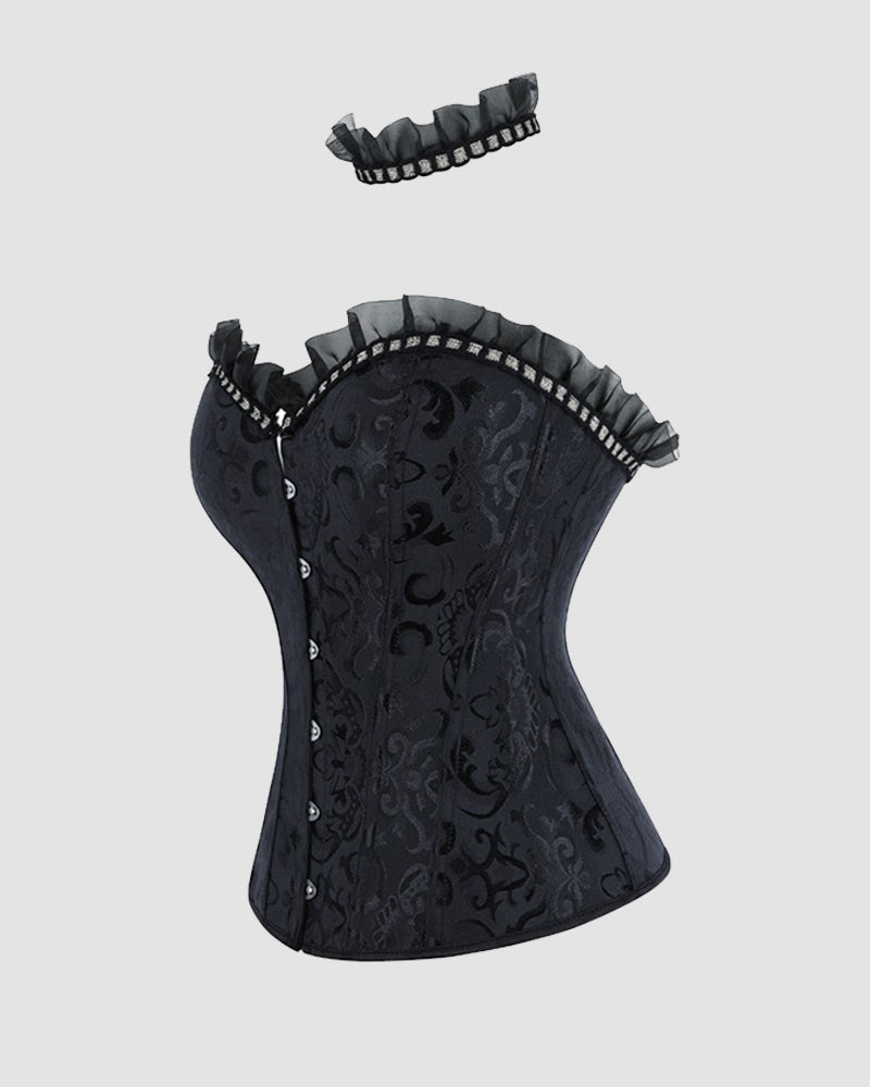 Black corset top side view with ruffled trim and embossed brocade texture
