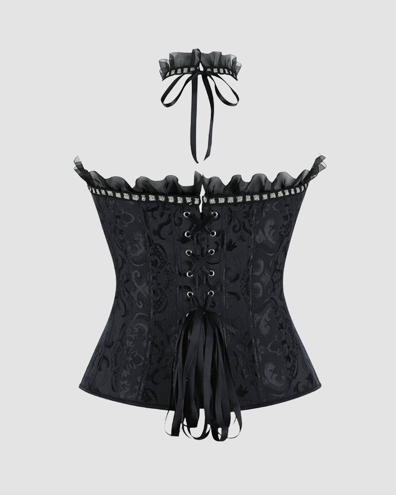 Black strapless corset top with lace-up front, ruffled trim, and bow tie detail