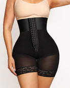 Black high-waisted shapewear shorts with front hook-and-eye panel and lace hem