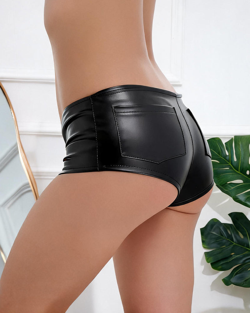 High-waisted faux leather mini shorts in black, side view with patch pocket stitching