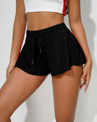 Black high-waisted drawstring flared shorts with side tie details